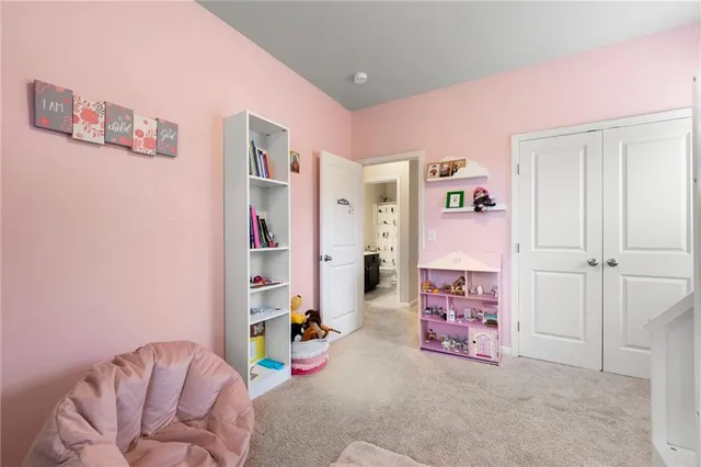 a bedroom with a bed and a couch