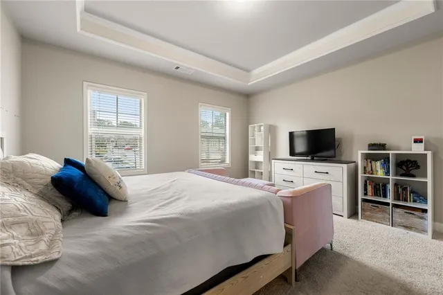 a bathroom with a sink mirror and a shower