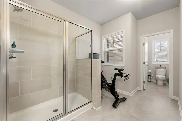 a view of walk in closet with clothes