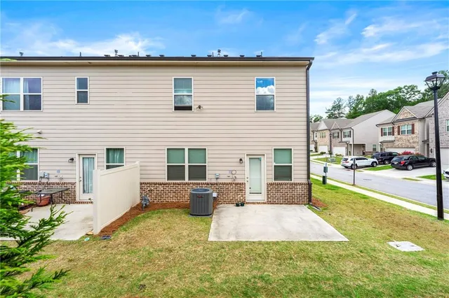 a view of a house with dining room and a yard