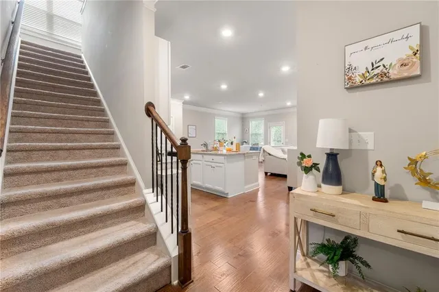 a view of living room with furniture and wooden floor