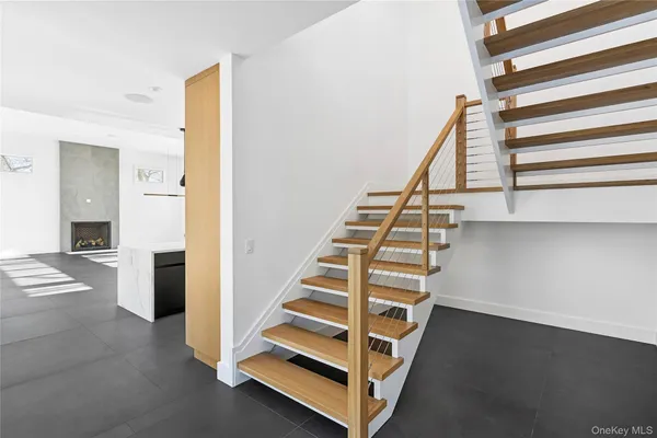 a view of entryway with wooden floor and stairs