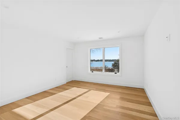 a view of an empty room and window