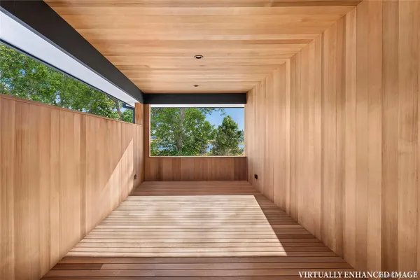 a view of balcony with wooden floor