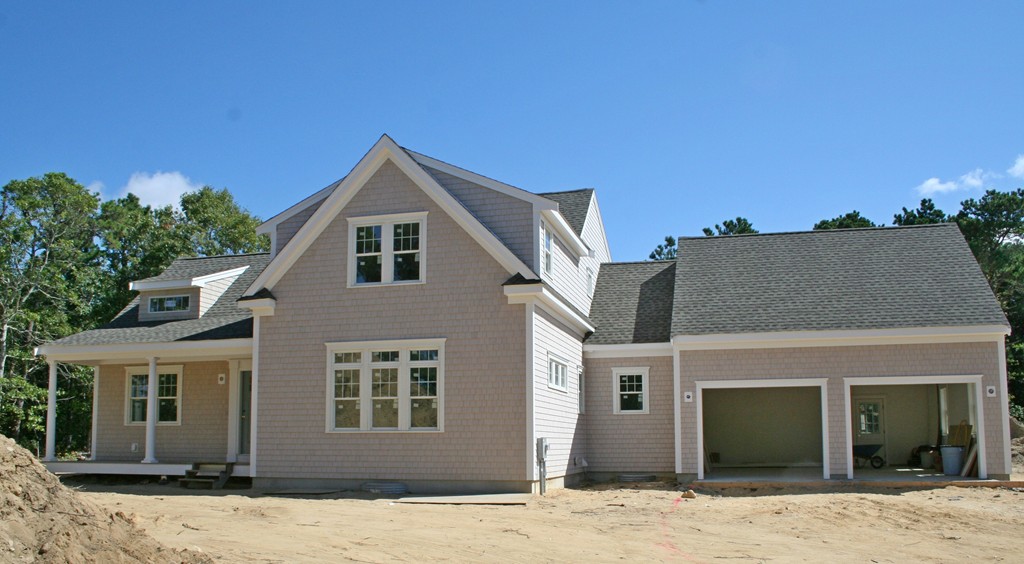 90 Pine Ridge Road Brewster, MA 02631 - Photo 2 of 11 a front view of a house with a yard