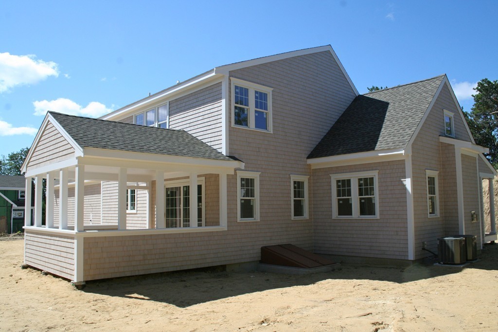 90 Pine Ridge Road Brewster, MA 02631 - Photo 10 of 11 a front view of a house with a yard