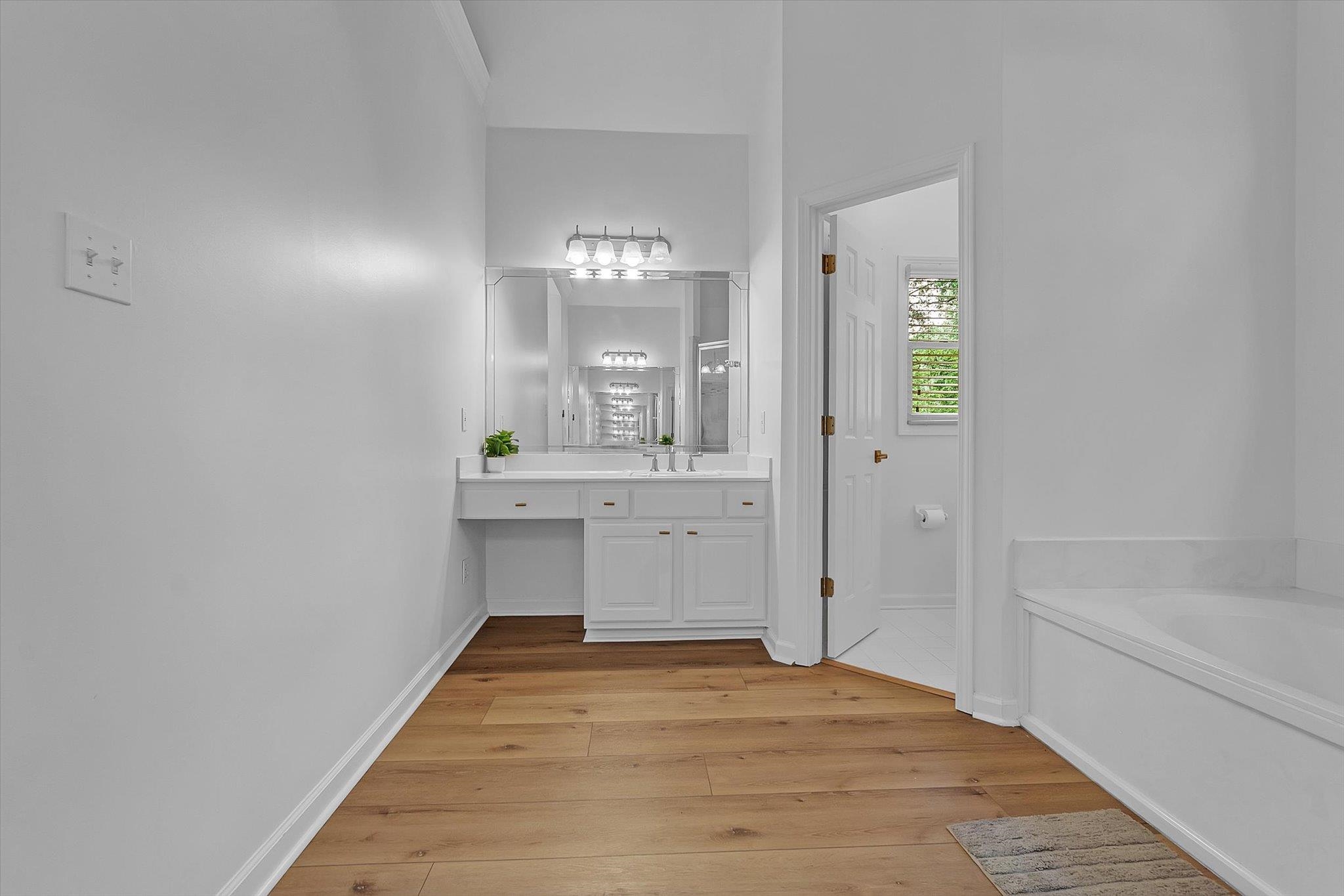 8786 Stablemill Lane Memphis, TN 38016 - Photo 15 of 40 a bathroom with a sink and a mirror