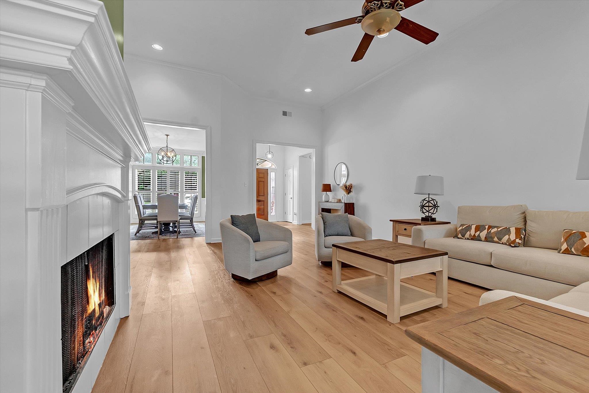 8786 Stablemill Lane Memphis, TN 38016 - Photo 17 of 40 a living room with fireplace furniture and a wooden floor