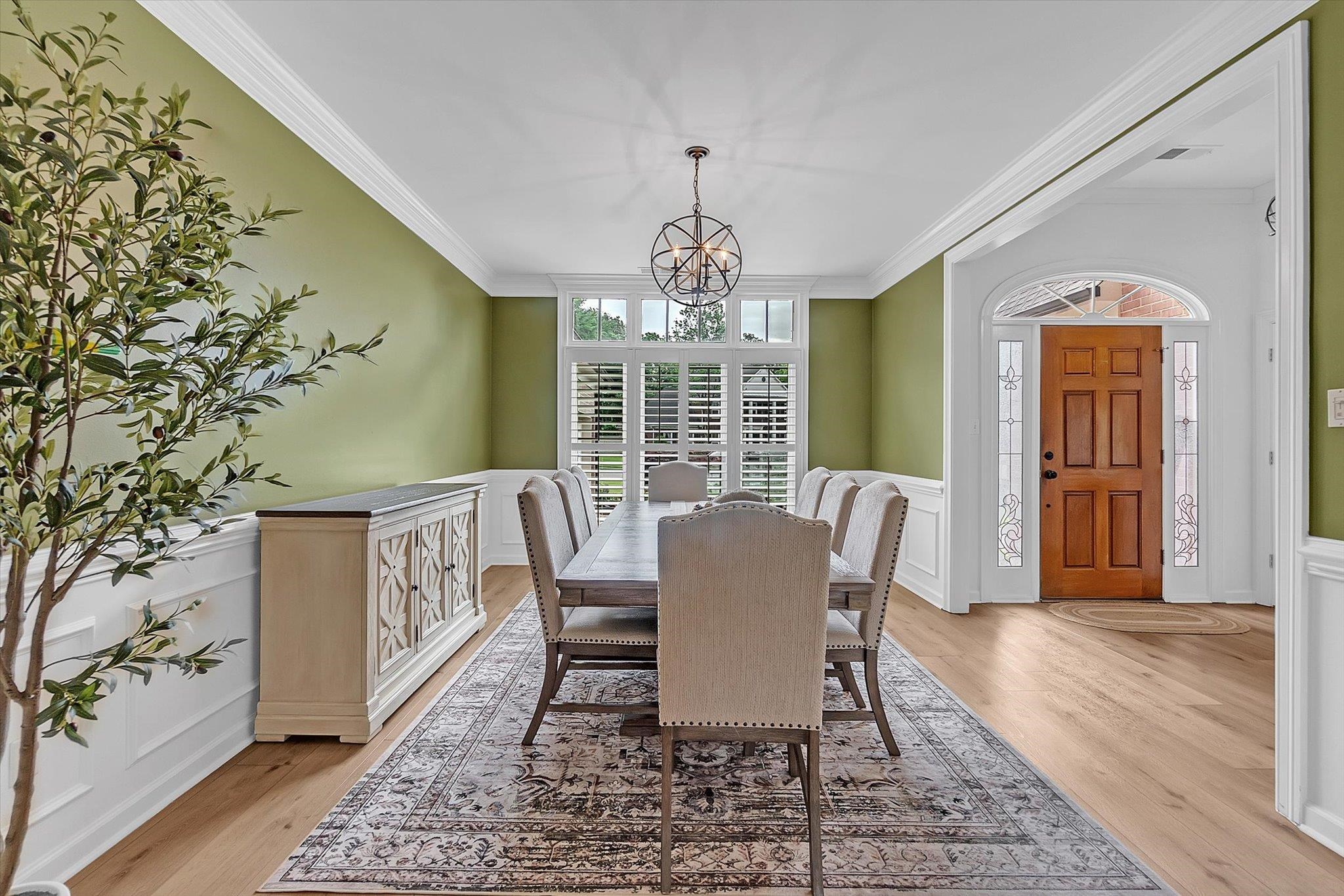 8786 Stablemill Lane Memphis, TN 38016 - Photo 18 of 40 a view of a dining room with furniture window and wooden floor