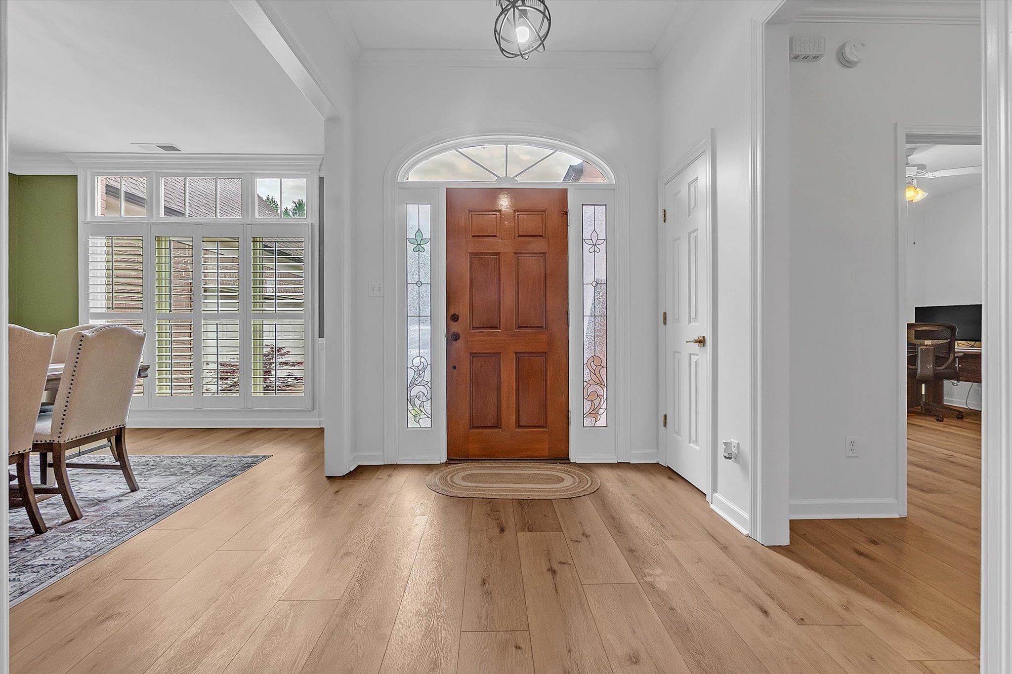 8786 Stablemill Lane Memphis, TN 38016 - Photo 19 of 40 wooden floor in an empty room with a window