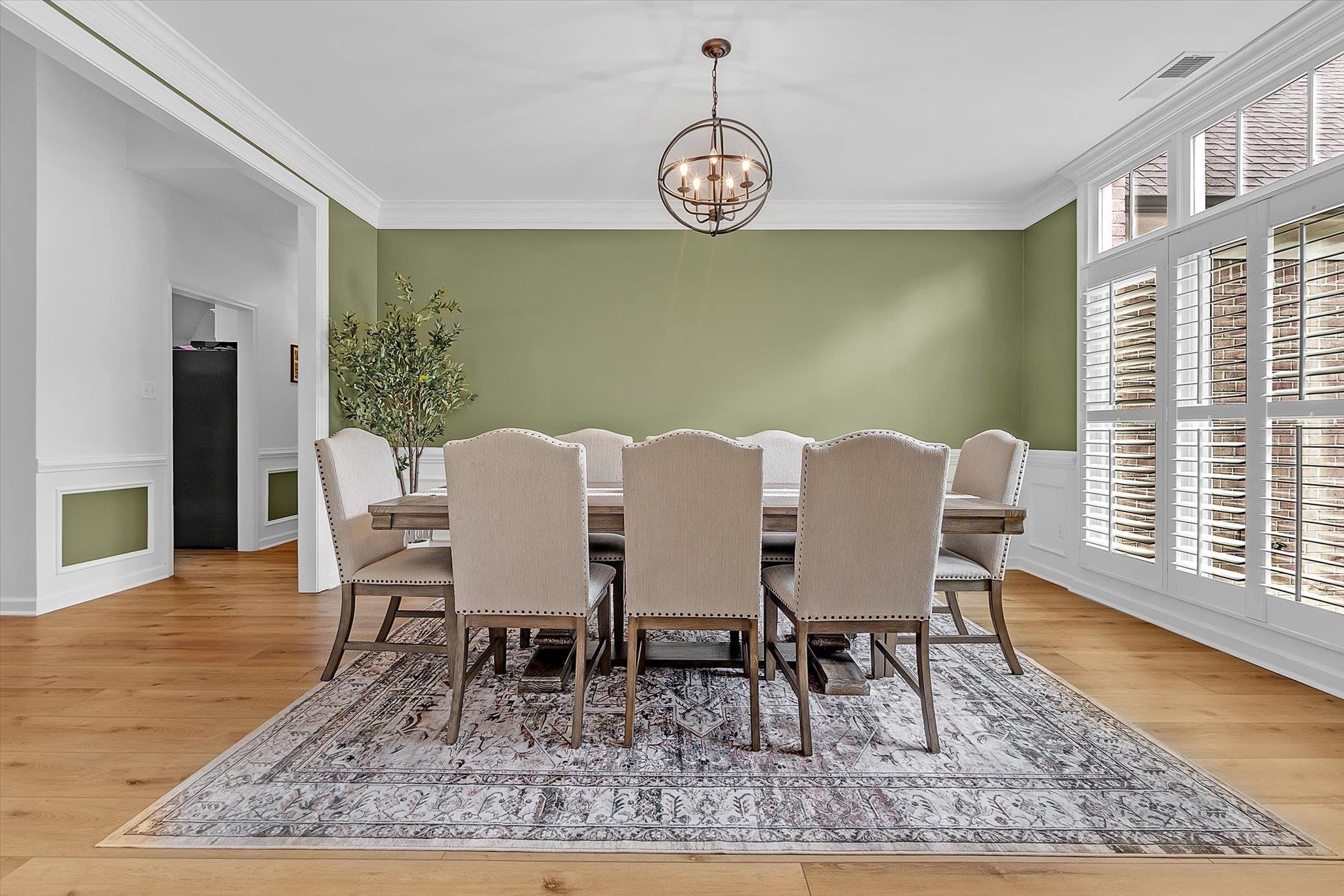 8786 Stablemill Lane Memphis, TN 38016 - Photo 20 of 40 a view of a dining room with furniture window and wooden floor