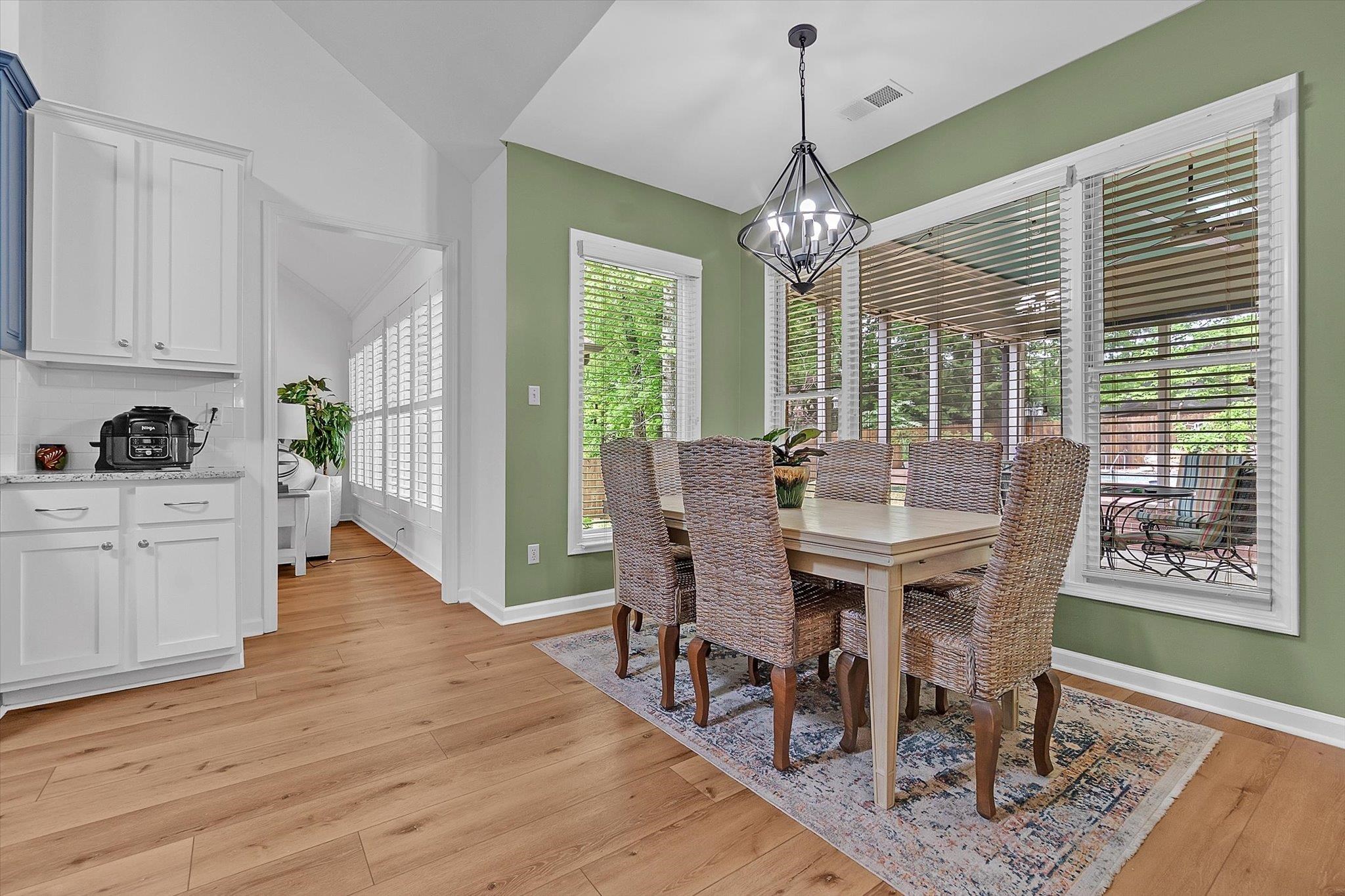 8786 Stablemill Lane Memphis, TN 38016 - Photo 23 of 40 a view of a dining room with furniture window and wooden floor