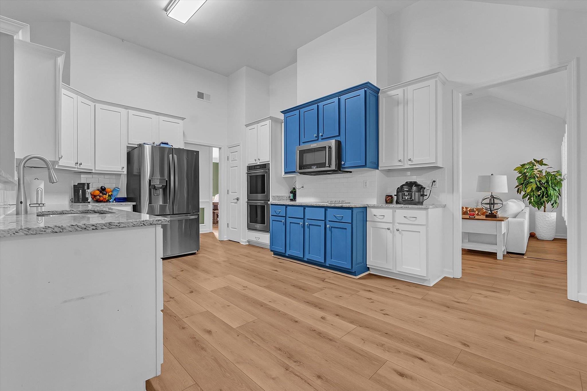 8786 Stablemill Lane Memphis, TN 38016 - Photo 25 of 40 a kitchen with stainless steel appliances a refrigerator sink and cabinets