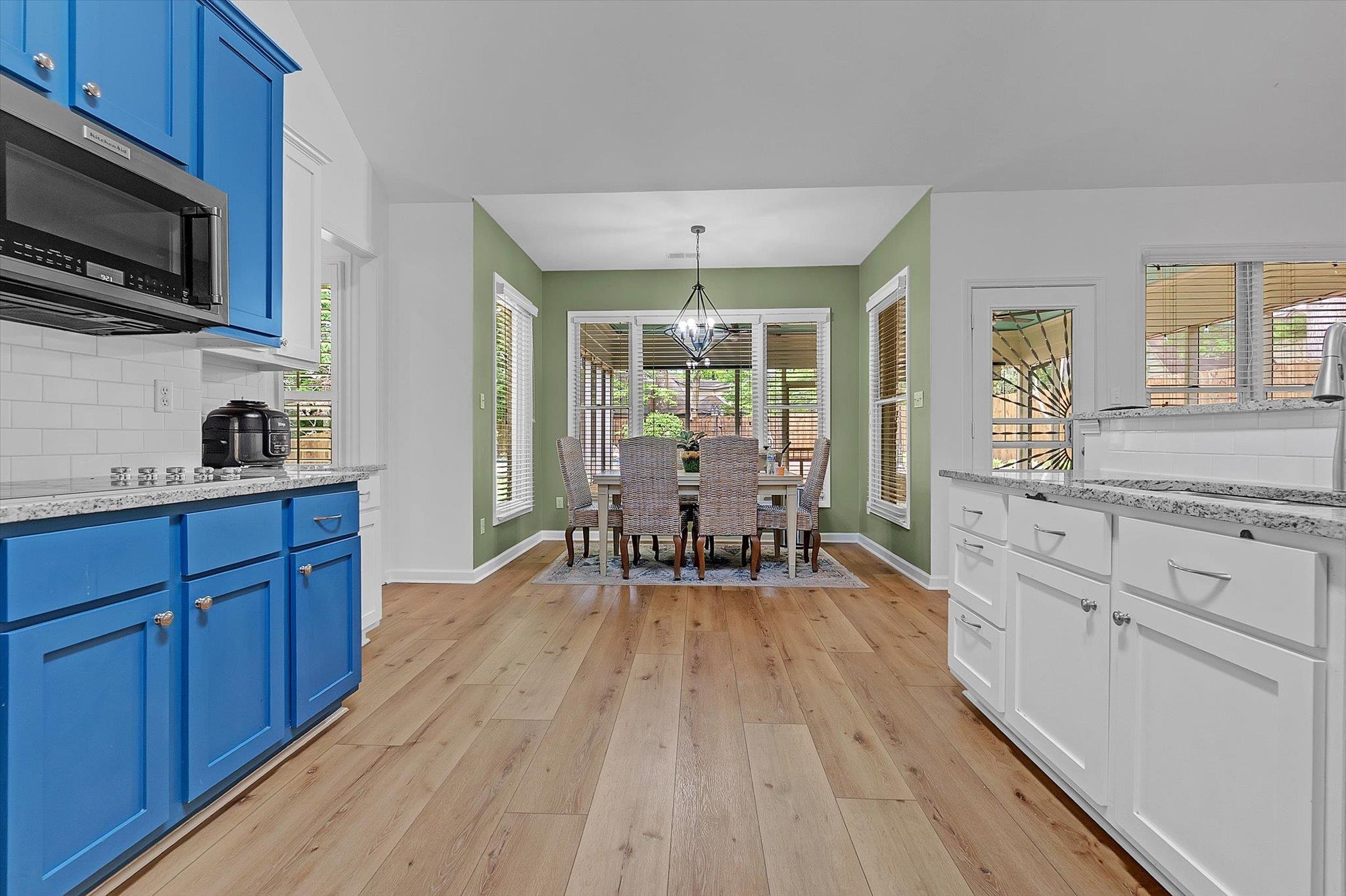 8786 Stablemill Lane Memphis, TN 38016 - Photo 28 of 40 a kitchen with wooden floors and wooden cabinets