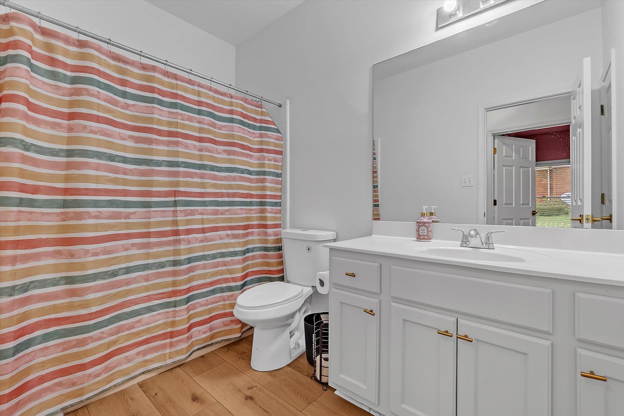 8786 Stablemill Lane Memphis, TN 38016 - Photo 29 of 40 a bathroom with a sink toilet and shower