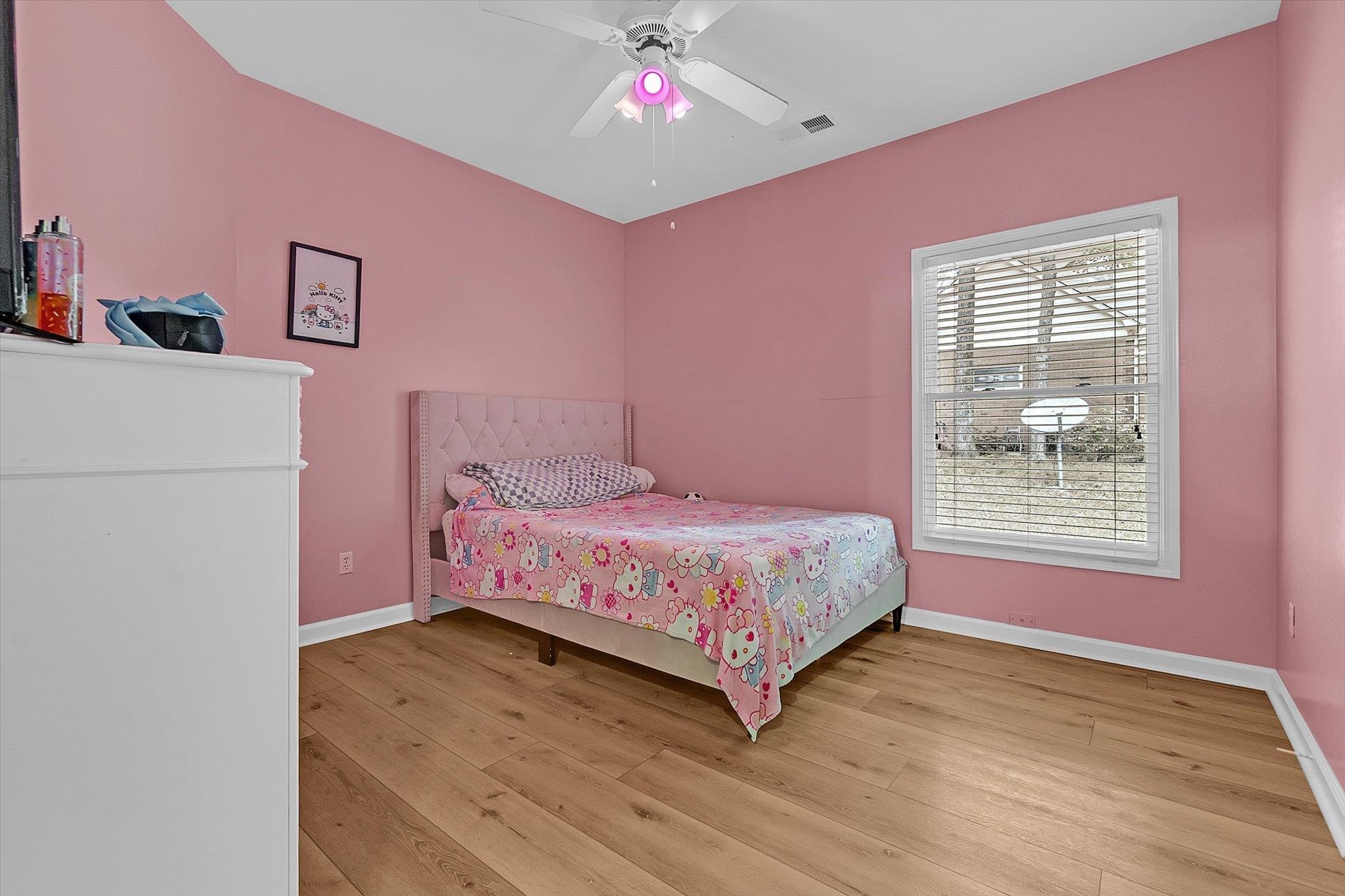 8786 Stablemill Lane Memphis, TN 38016 - Photo 30 of 40 a bedroom with a bed dresser and a window