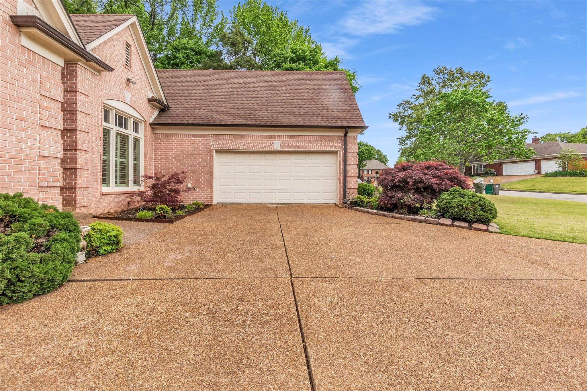 8786 Stablemill Lane Memphis, TN 38016 - Photo 3 of 40 a house with lots of trees in the background