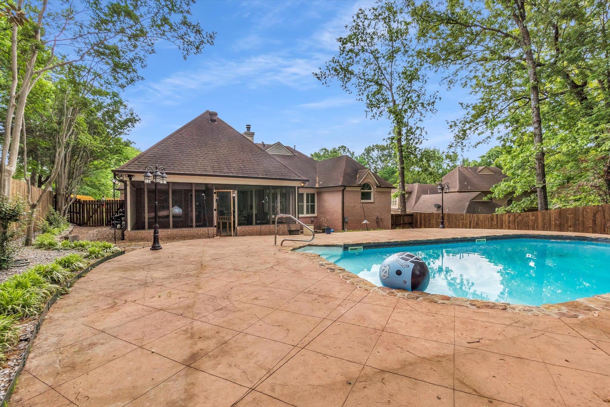 8786 Stablemill Lane Memphis, TN 38016 - Photo 39 of 40 a view of a house with swimming pool and sitting area