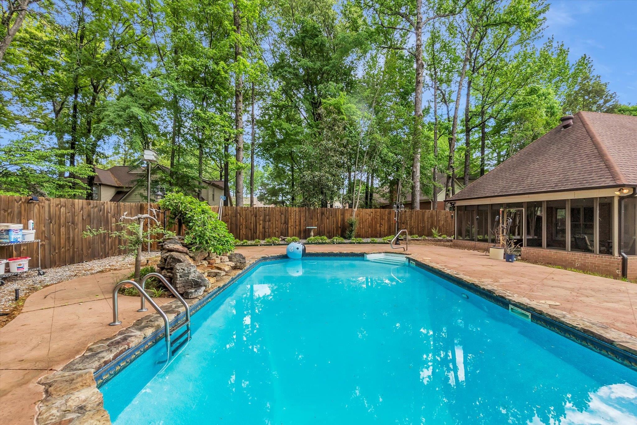 8786 Stablemill Lane Memphis, TN 38016 - Photo 40 of 40 a swimming pool with outdoor seating and yard