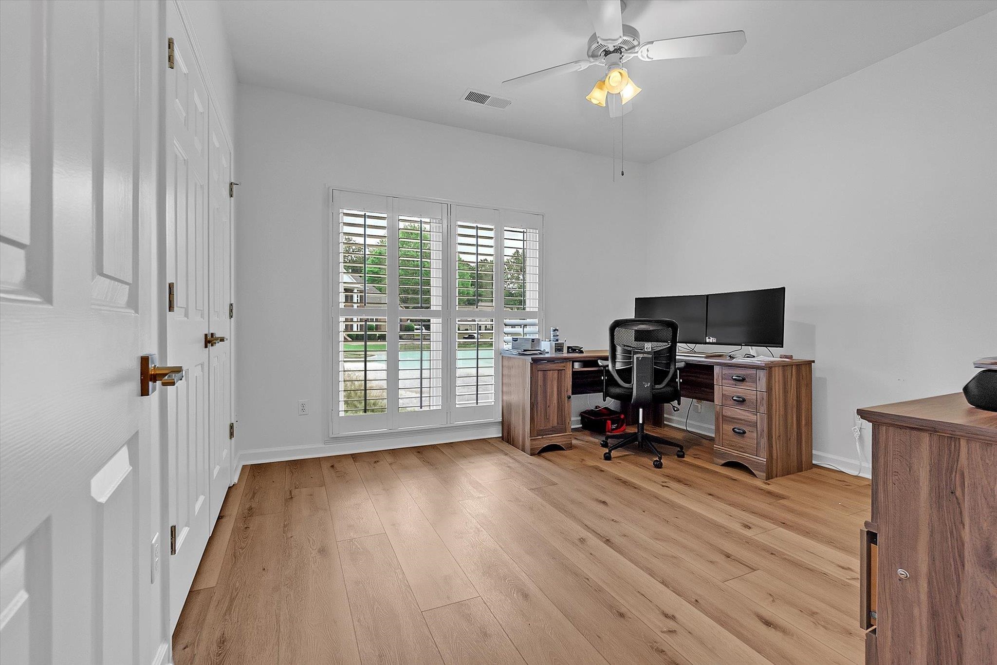 8786 Stablemill Lane Memphis, TN 38016 - Photo 8 of 40 a view of a workspace with furniture and a window