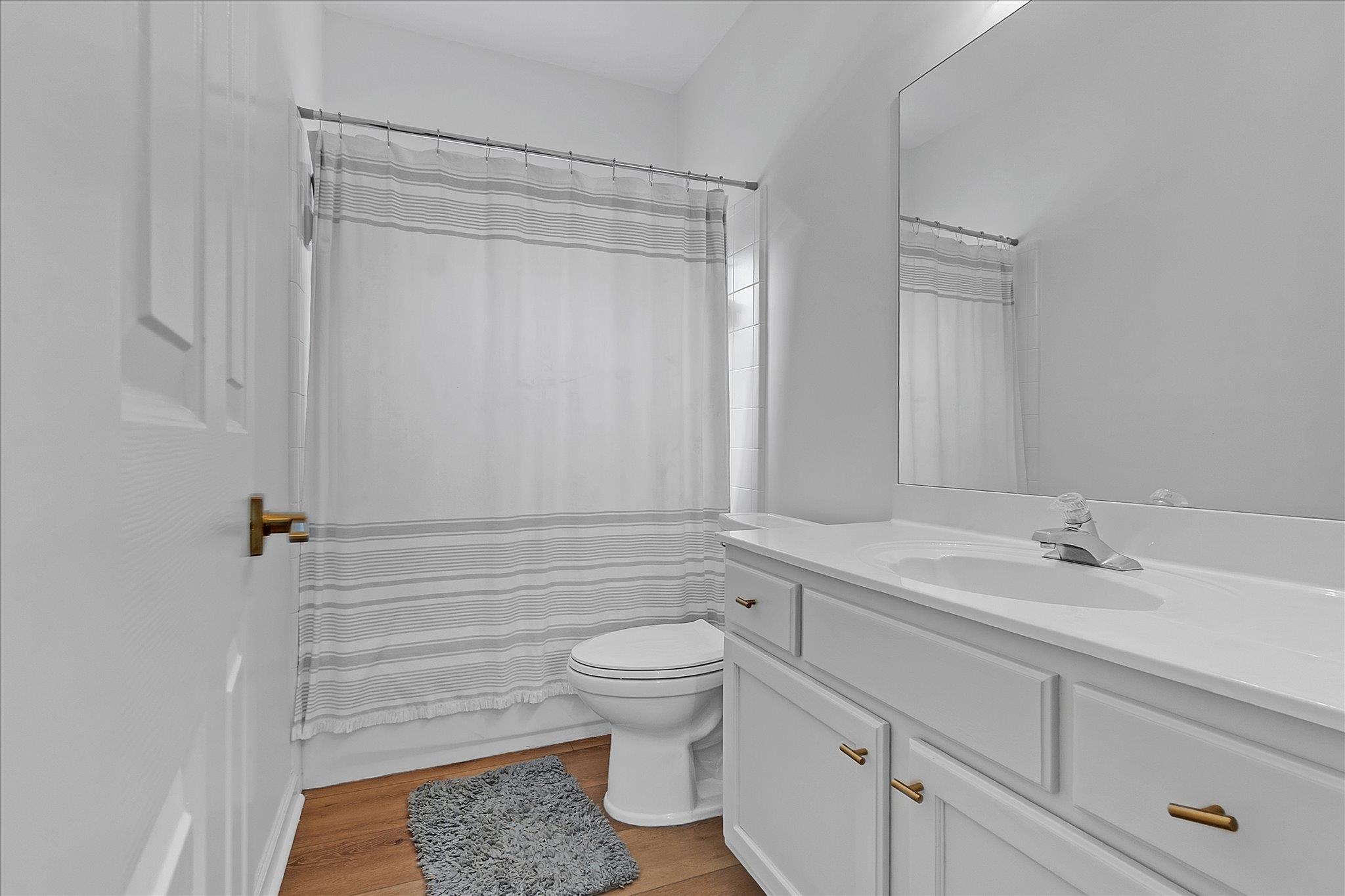 8786 Stablemill Lane Memphis, TN 38016 - Photo 9 of 40 a bathroom with a sink a toilet and shower