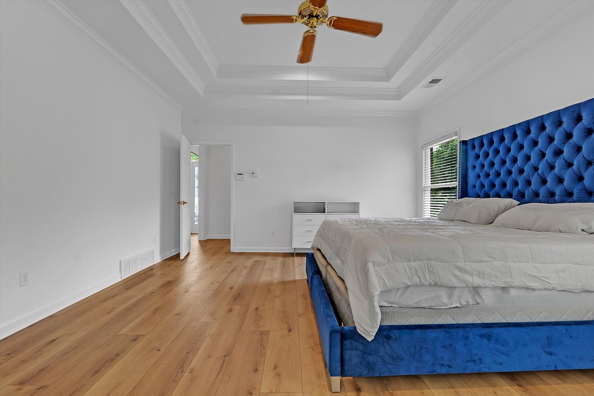 8786 Stablemill Lane Memphis, TN 38016 - Photo 10 of 40 a bedroom with a bed and wooden floor