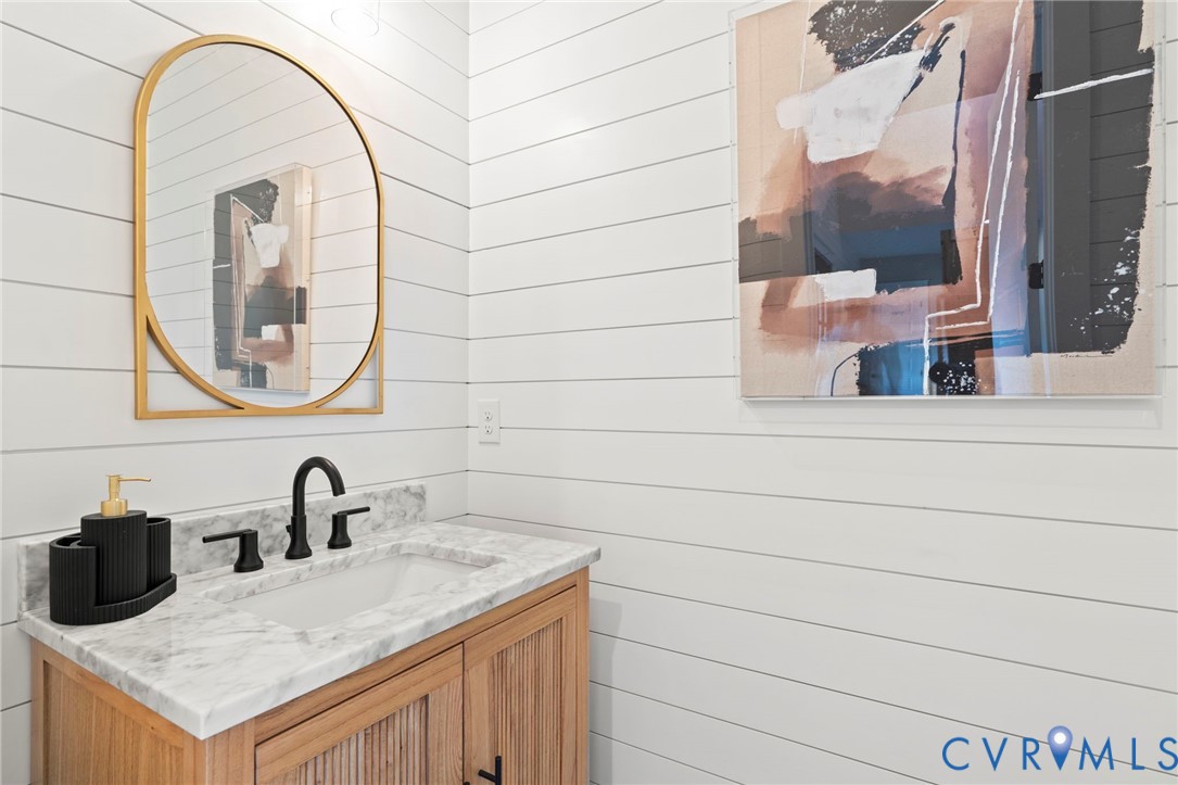 4764 Gooden Trail Quinton, VA 23141 - Photo 20 of 50 Bathroom with vanity and wood walls