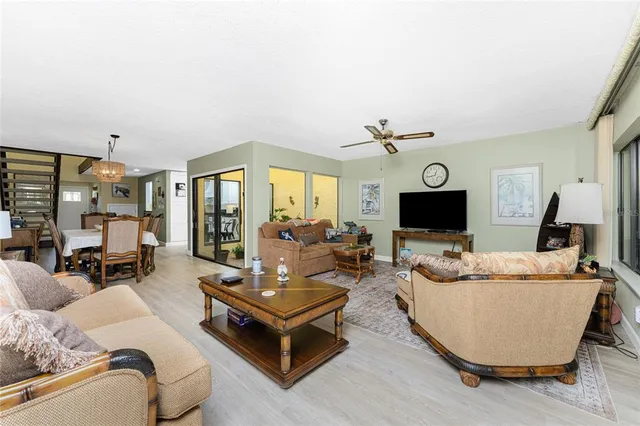a dining room with furniture water view and a fireplace