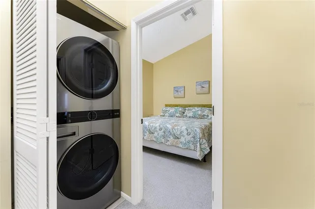 a bedroom with a bed and a table