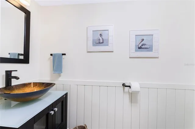 a dining room with furniture and a floor to ceiling window