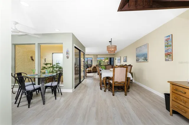 a dining room with furniture and wooden floor