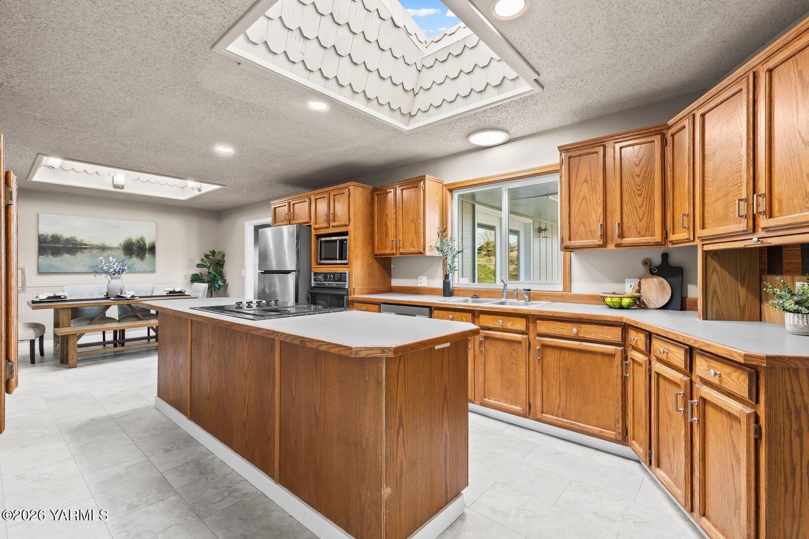 2030 Sunset Way Cowiche, WA 98923 - Photo 11 of 57 a kitchen with stainless steel appliances granite countertop lots of counter top space