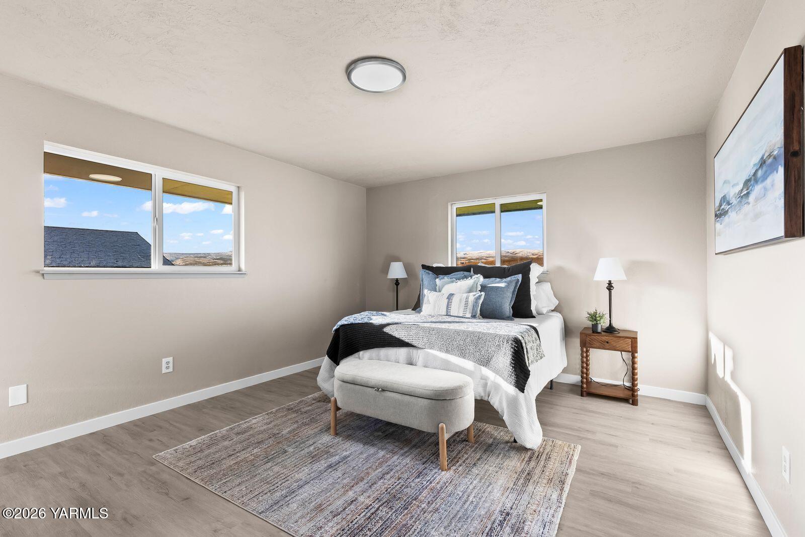 2030 Sunset Way Cowiche, WA 98923 - Photo 17 of 57 a bed room with a bed and a lamp