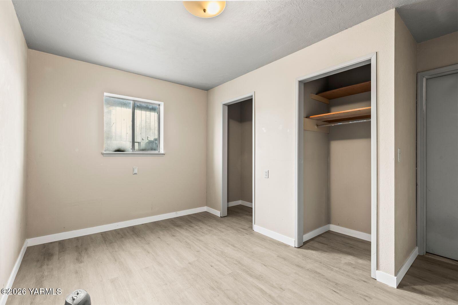 2030 Sunset Way Cowiche, WA 98923 - Photo 44 of 57 an empty room with wooden floor closet and windows