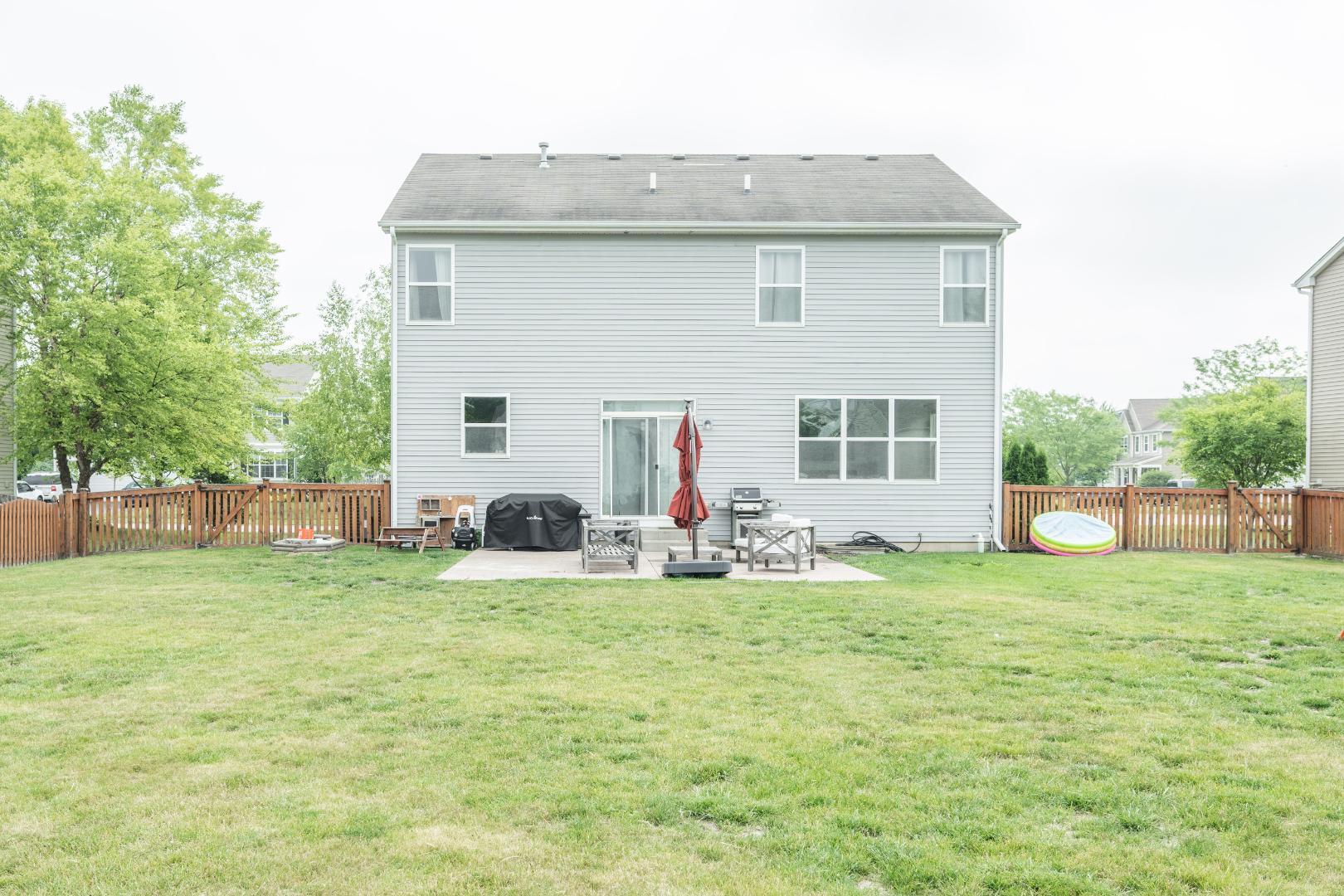 4333 Schofield Drive Oswego, IL 60543 - Photo 14 of 14 a view of a house with a yard and sitting area