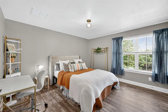 a bed room with a bed and a chandelier