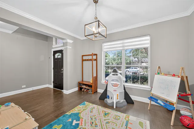 a living room with furniture a rug floor and a window