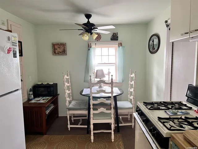 a kitchen with a table and chairs