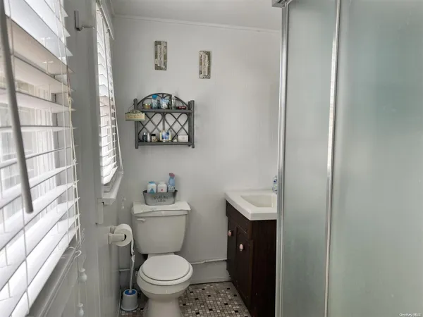 a bathroom with a toilet and a sink