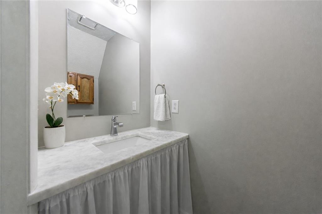 1960 Hamilton Place Southeast Marietta, GA 30067 - Photo 5 of 22 a bathroom with a sink and a mirror