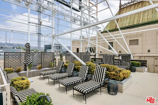 a view of balcony with furniture