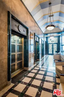 a view of a patio with a table and chairs