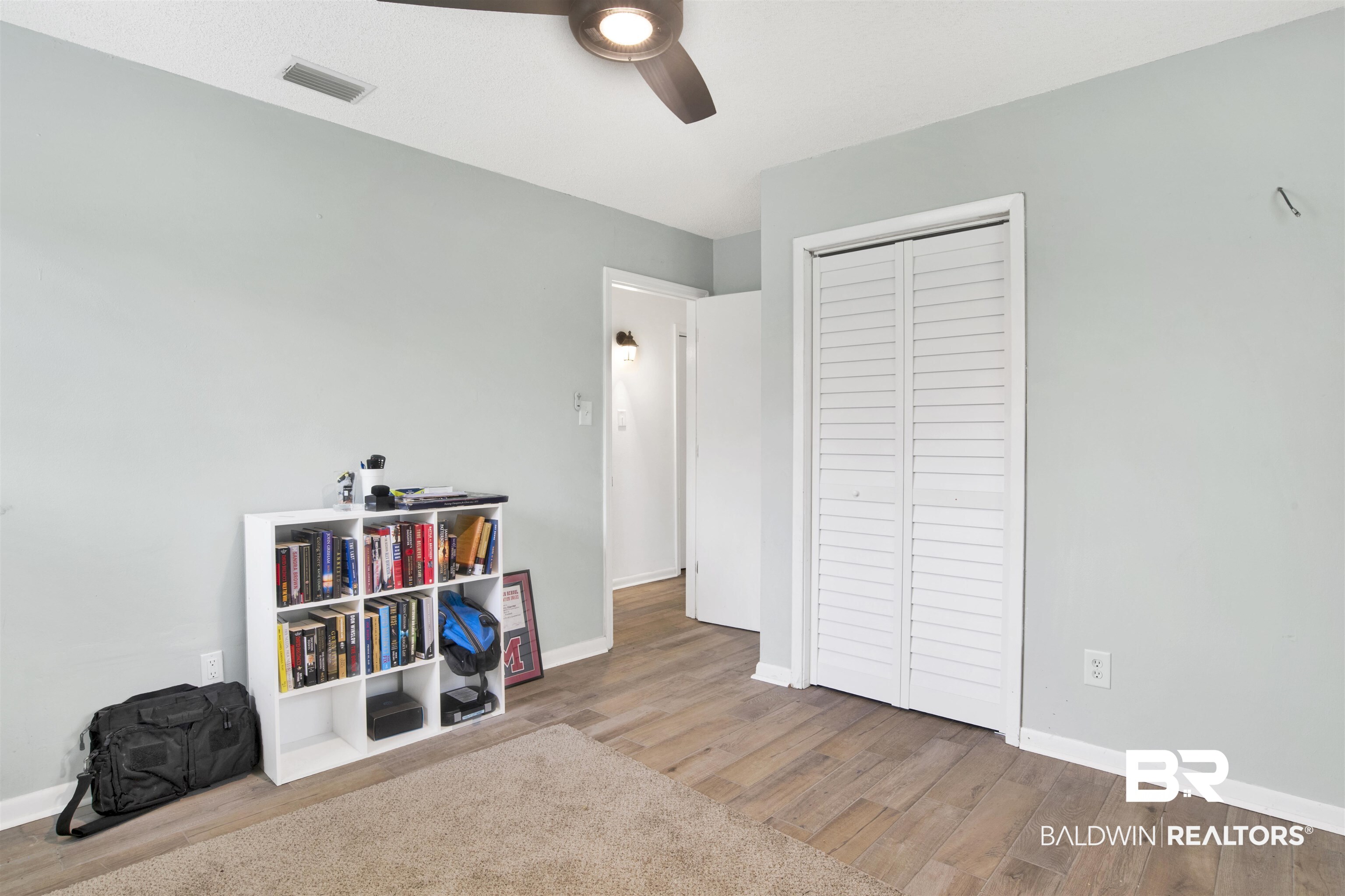 10244 Magnolia Road Irvington, AL 36544 - Photo 13 of 37 Game room featuring baseboards, visible vents, wood finished floors, and ceiling fan