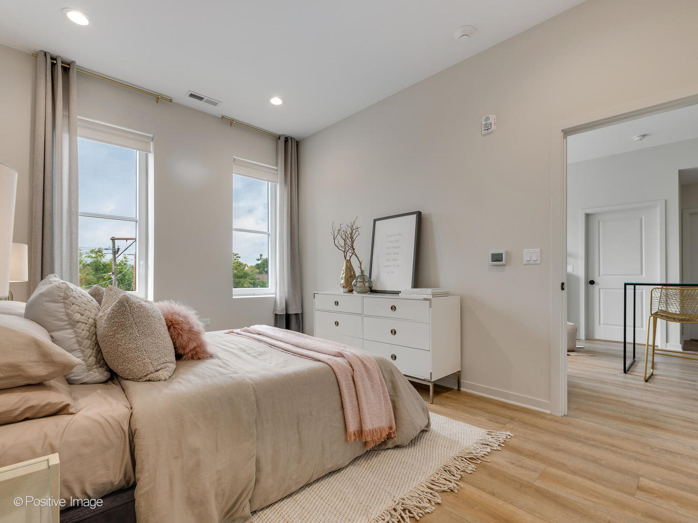 2811 Thatcher Avenue, Unit 204 River Grove, IL 60171 - Photo 13 of 44 a bedroom with a large bed and wooden floor