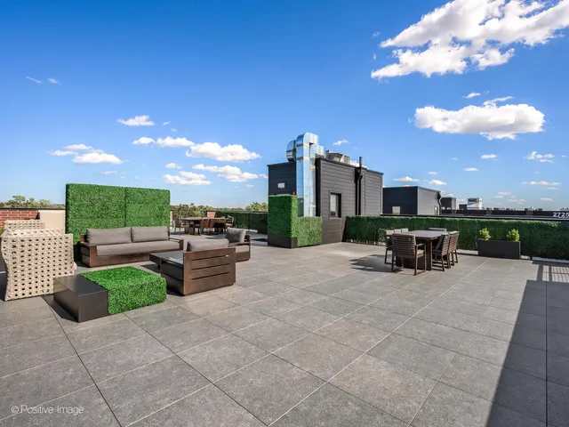 a view of a terrace with couches and a table