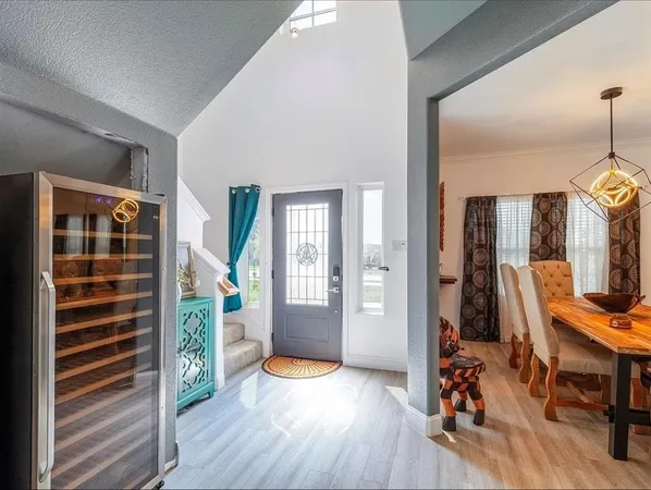 a view of room with furniture and wooden floor