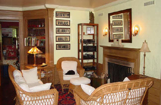 6066 Cunningham Road Rockford, IL 61102 - Photo 2 of 6 a living room with furniture a fireplace and window