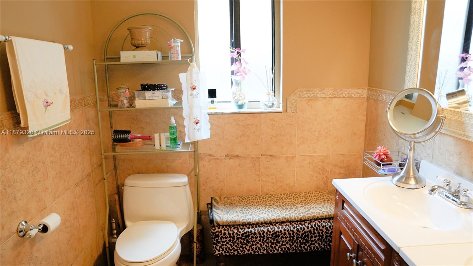 14856 Southwest 174th Street Miami, FL 33187 - Photo 12 of 31 a bathroom with a sink toilet and a mirror