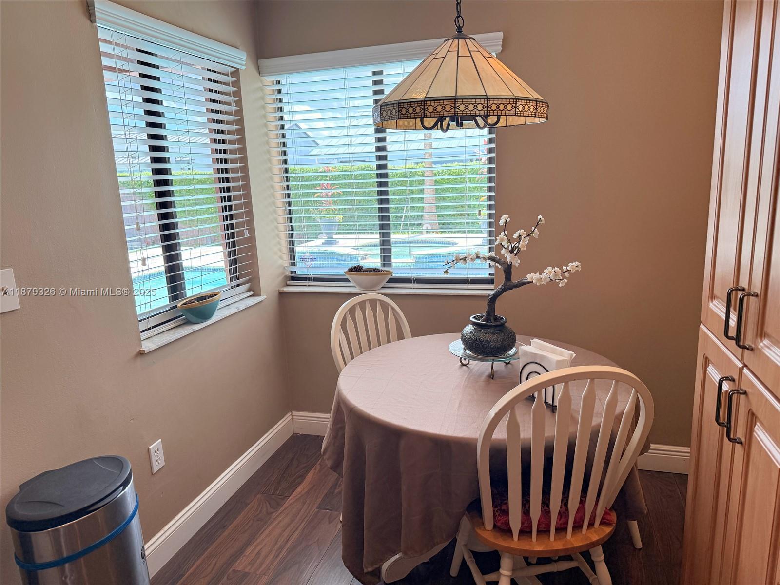 14856 Southwest 174th Street Miami, FL 33187 - Photo 17 of 31 a dining room with furniture and window