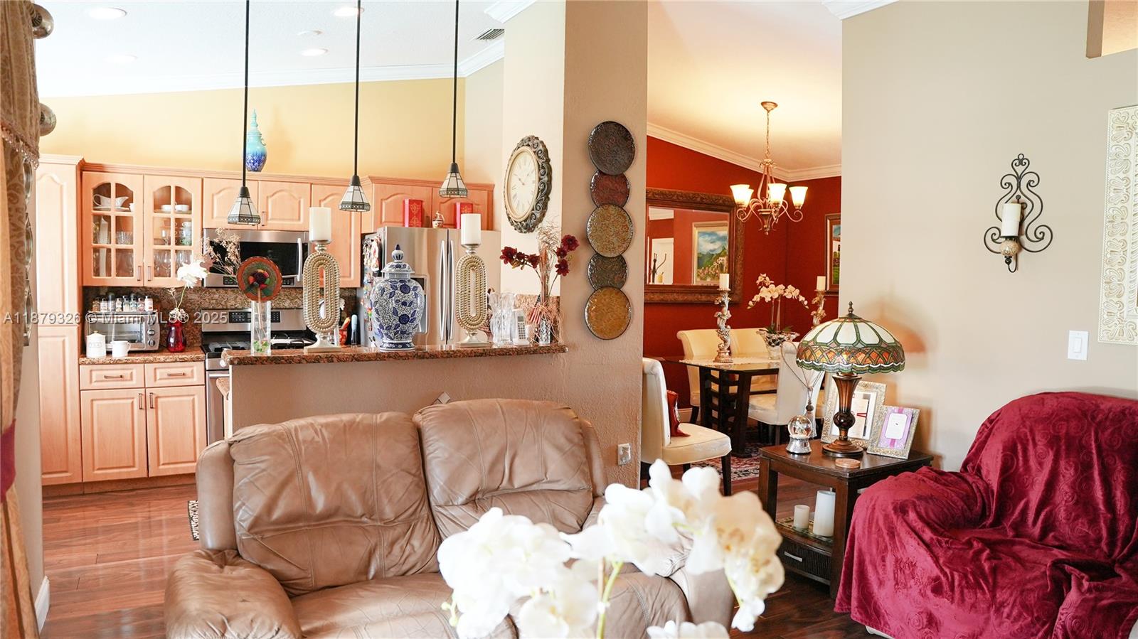 14856 Southwest 174th Street Miami, FL 33187 - Photo 18 of 31 a living room with furniture and chandelier